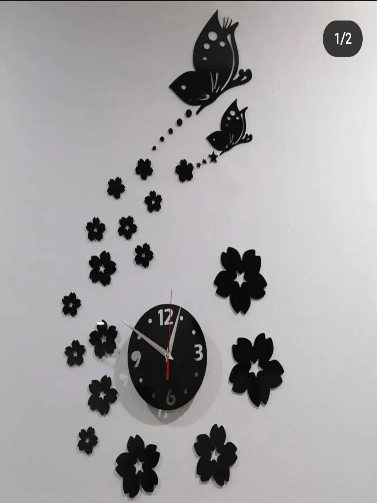 Elegant butterfly acrylic wall clock, gold accents, time display, decorative art piece.